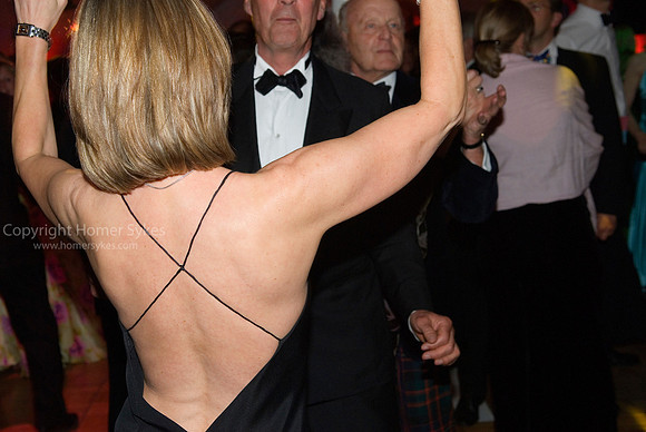 Cocktail party dress younger woman dancing with older man UK
